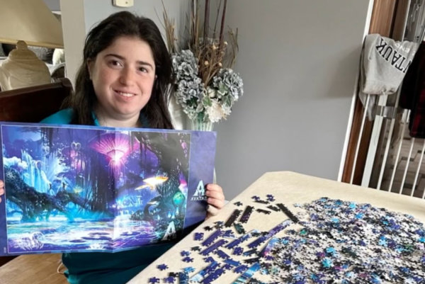 woman playing with jigsaw puzzle