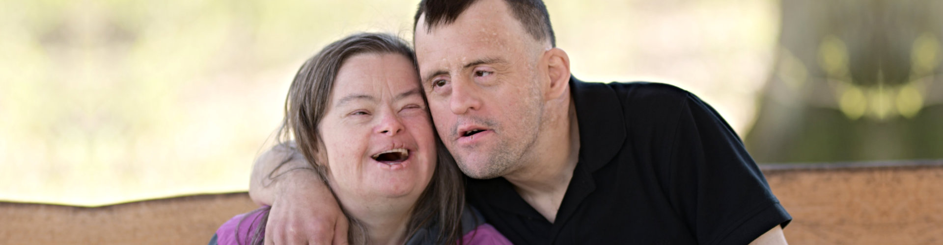couple with down syndrome smiling
